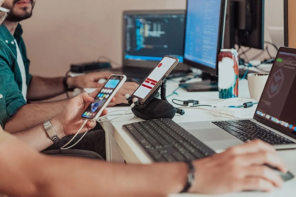 Programmers engrossed in deep collaboration, diligently working together to solve complex problems and develop innovative