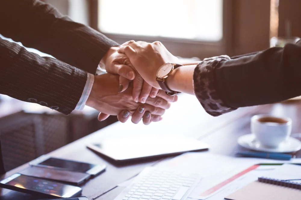 Business partners holding hands