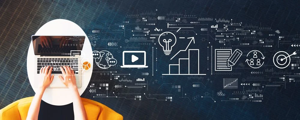Content marketing concept with person using a laptop on a white table